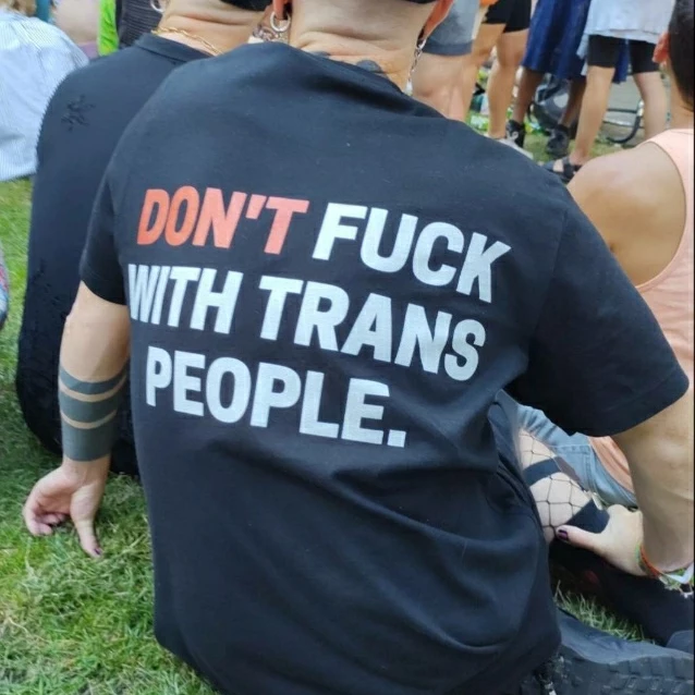 A photo of the back of someone’s shirt with says “Don’t fuck with trans people.”